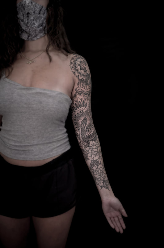 Snake and Mandala Floral Sleeve Tattoo by Adam LoRusso artist black and grey 
