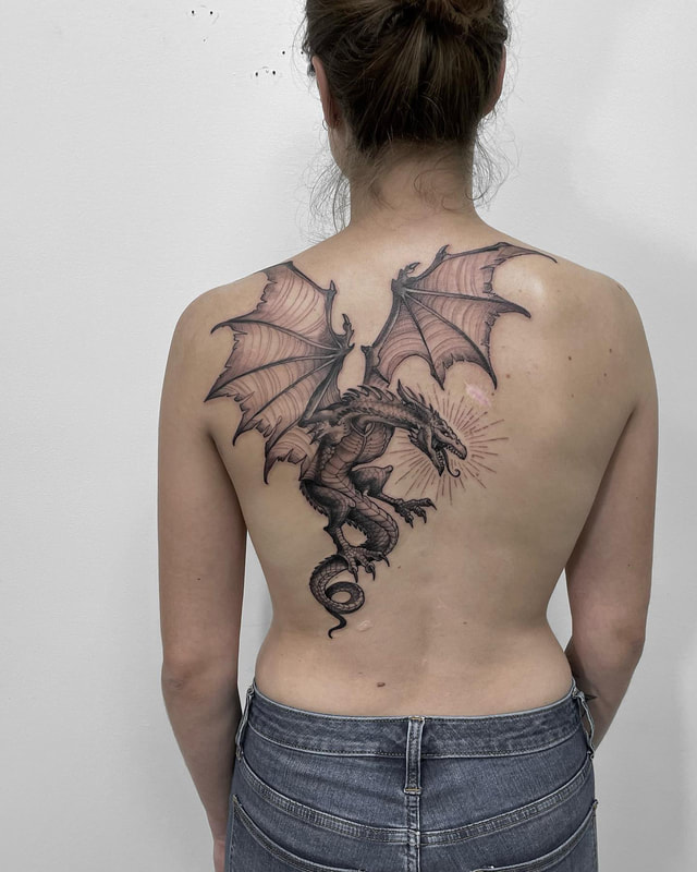 Dragon back tattoo by tattoo artist Adam LoRusso Last Light Tattoo Studio Medford Massachusetts