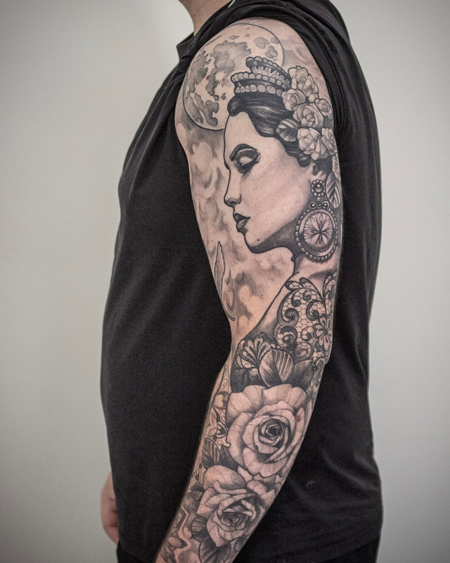 Woman face tattoo on a sleeve