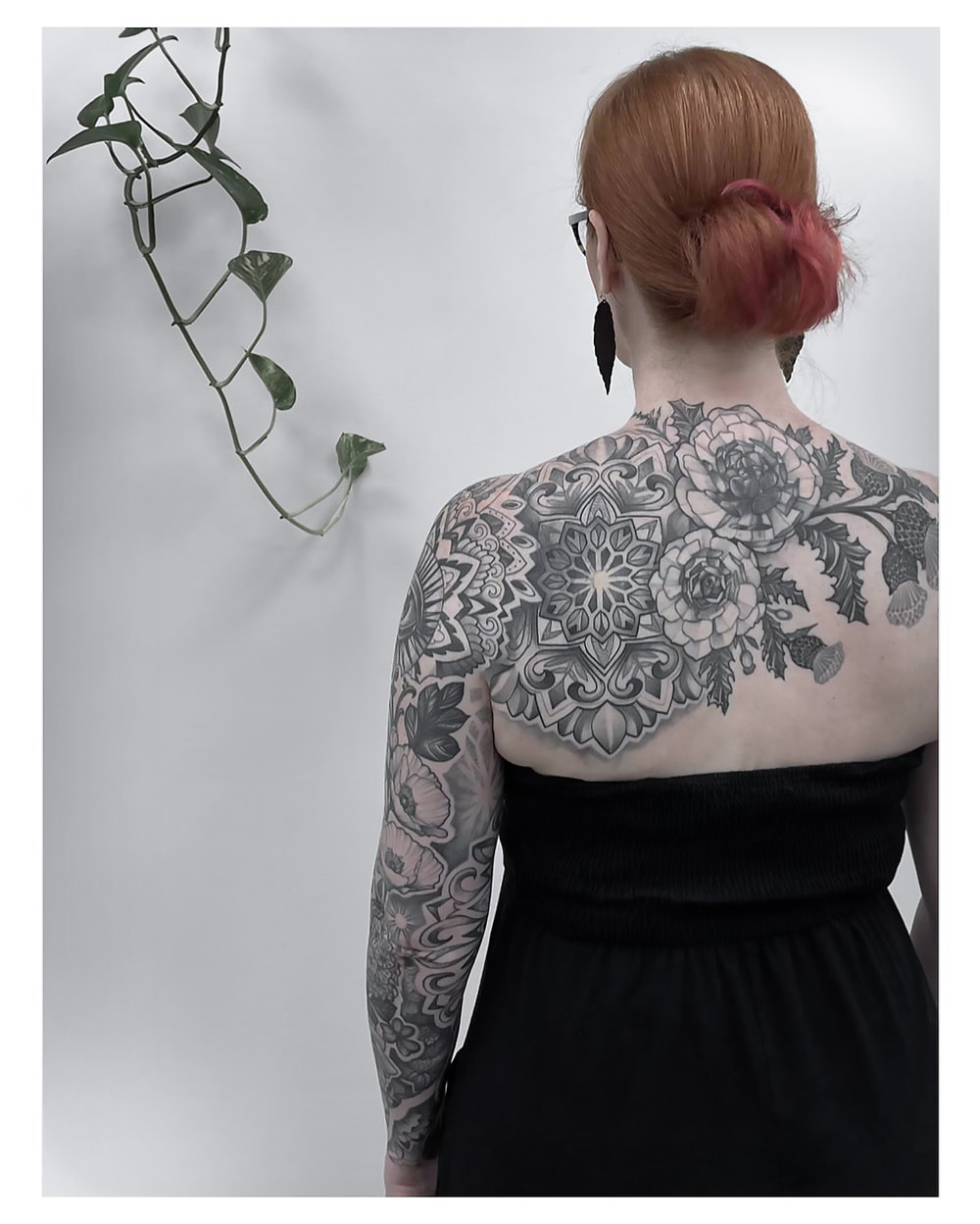 Woman with a sleeve and back tattoo by Adam LoRusso