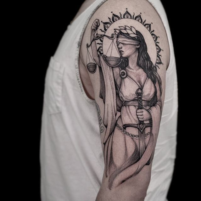 Lady justice tattoo in black and gray