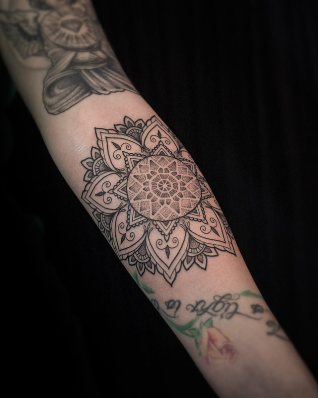Tattoo by Adam LoRusso artist black and grey boston mandala forearm tattoo