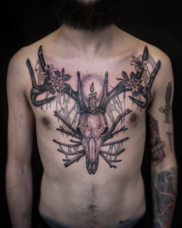 Chest piece full front Tattoo by Adam LoRusso artist black and grey boston skull chest piece