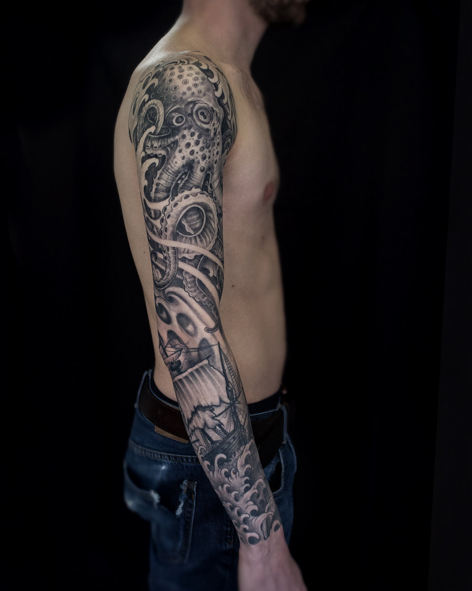 Man with an octopus sleeve of a kraken and a ship