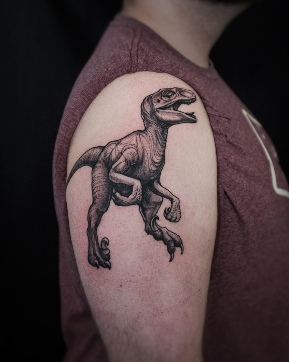 A tattoo of the dinosaur Velociraptor 