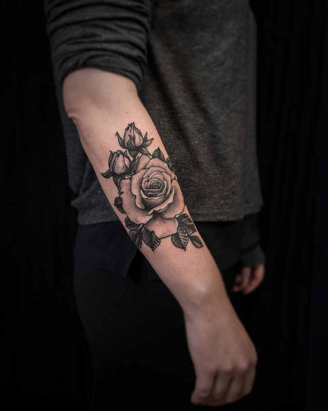 Tattoo by Adam LoRusso artist black and grey boston rose forearm tattoo