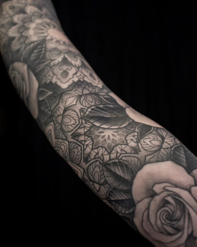 Tattoo by Adam LoRusso artist black and grey boston patterns rose