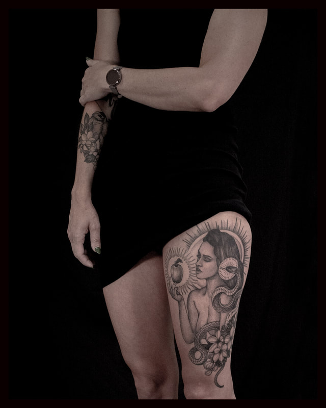 Eve and the serpent and the apple tattoo leg piece